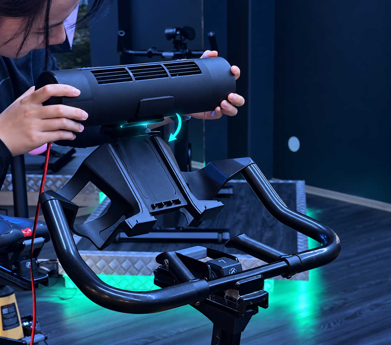 The fan being rotated to lock into the handlebar holder